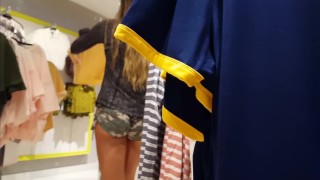 Candid voyeur girl shopping in tiny camo shorts